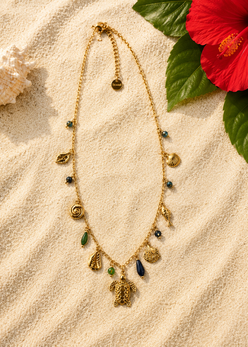 Collier multiple breloques tortue coquillage perle et poisson